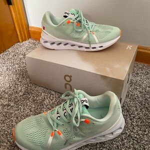 On Running Women's Athletic Shoes in Mint and Orange